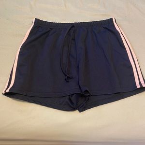 Dark blue shorts with 2 pink stripes on the side